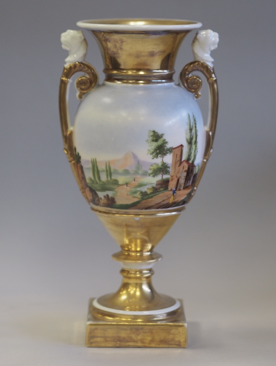 Early 19th Century Continental porcelain two handled urn, enamelled with Italianate country