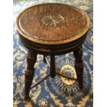 Victorian stained elm stool, the seat carved with rosette, seat 29cm diameter x 48cm high