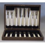 Set of four George V silver and ivorine handled fish forks and four fish knives by Harrison Brothers