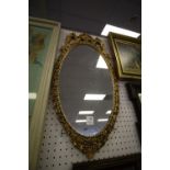 Gilt oval wall mirror