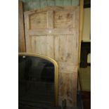 Arched and panelled pine door
