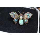 Early 20th Century gilt metal opal and ruby set butterfly clip