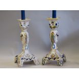 Pair Quimper pottery candlesticks, 26cm high (one sconce chipped)