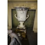 Large cast iron garden urn on plinth