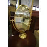 Brass framed oval toilet mirror