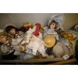 Box of porcelain headed dolls and others