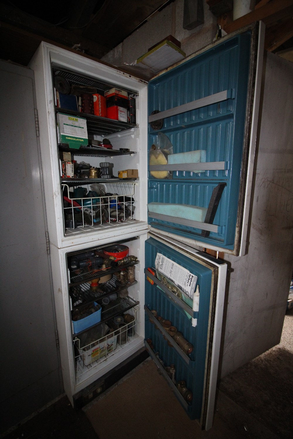 Vintage KPS fridge freezer containing mixed fuel filters and parts