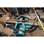 Two electric chainsaws