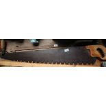 Vintage saw (handle wormed) and reaper