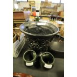 Holkham pottery, large classical black urn style vase and two owl eye mugs
