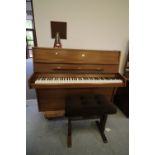 Eavestaff 'Minigrand' upright piano, with stool and metronome