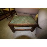 Wooden coffee table inset with slate top