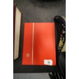 Red hardbound UK & foreign stamp album including Gibraltar, Isle of Man, World Cup 1966, etc