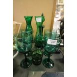 Glass decanter, glasses and vases