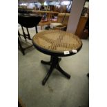 Revolving cane seated bentwood stool