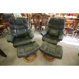 Pair of "Stressless" green leather recliners and foot stools