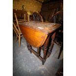 Oak drop leaf table and 4 Windsor kitchen chairs