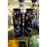 Pair of blue cylindrical vases with cherry blossom design