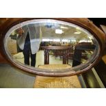 Open book shelves, chair and mirror