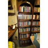 Arched top oak bookcase containing mixed CDs