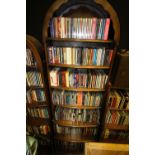 Arched top oak bookcase containing mixed CDs