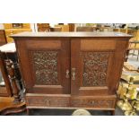 Carved oak cupboard