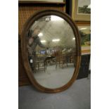 Pair of oval oak framed mirrors