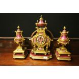 19th Century French gilt metal and porcelain three piece clock garniture, the clock striking on a