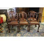 Set of six 1920's mahogany dining chairs of Sheraton design, including two armchairs, vinyl drop
