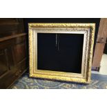 19th Century gilt picture frame, modelled with trailing leaves, 98cm x 88cm, to take picture 71cm