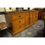19th Century grained pine sideboard, 217 cm wide x 64cm deep x 97cm high (later vinyl top)