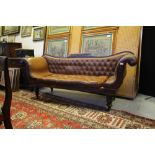 Early Victorian mahogany scroll arm three seat settee, upholstered in buttoned and studded brown