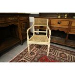 Regency white and gilt painted caned open armchair, later painted