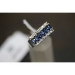 Silver (925) laboratory enhanced sapphire ring (size 8)