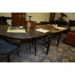 1930's Continental oak and stainded pine extending dining table, with unusual double drawleaf