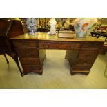 Reproduction mahogany leather topped desk