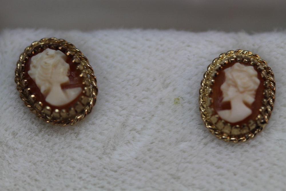 Yellow metal and cameo earrings