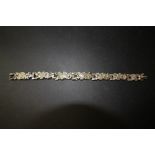 White metal bracelet of textured/Modernist design