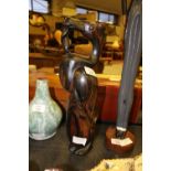 Hardwood carving of Cormorant swallowing a fish