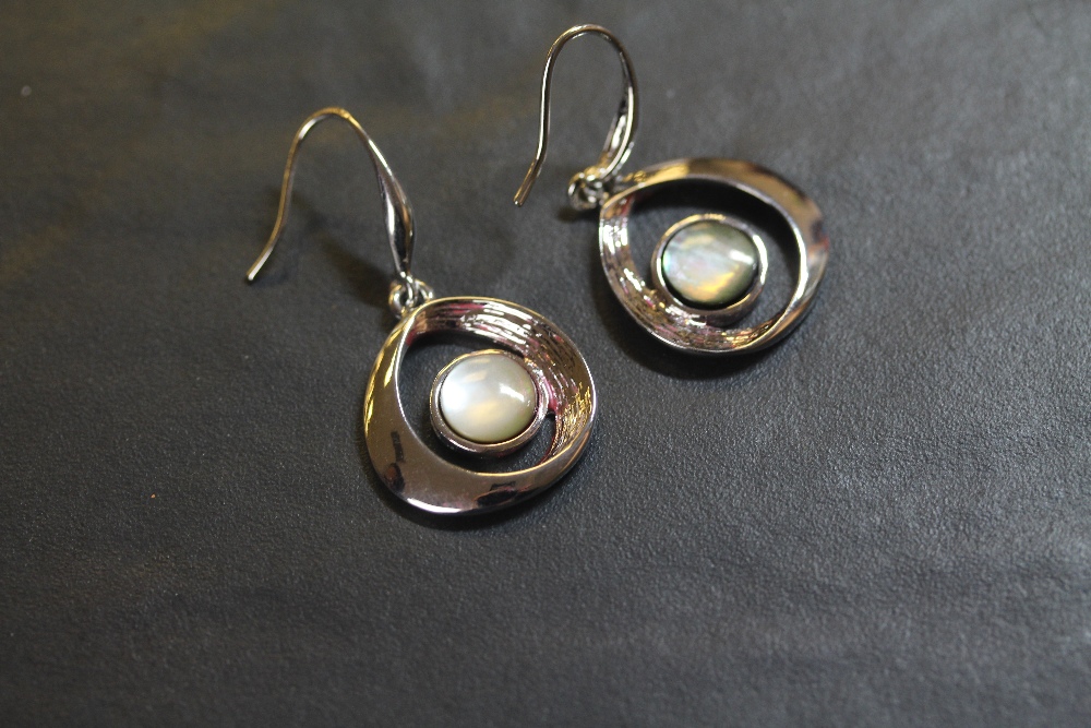 Pair of stainless steel and mother of pearl earrings