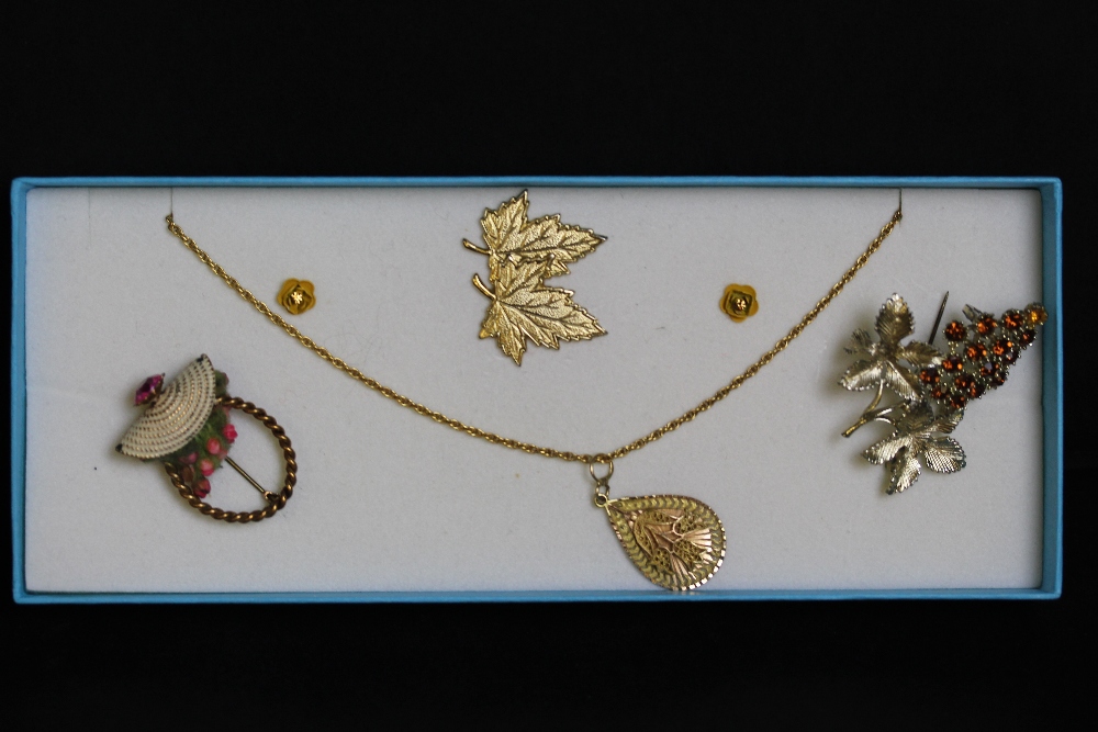 A small selection of foliate design costume jewellery