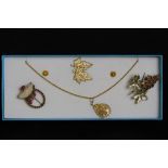 A small selection of foliate design costume jewellery