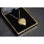 Heart shaped locket pendant marked 9ct front & Back with 9ct gold chain 6grams gross weight