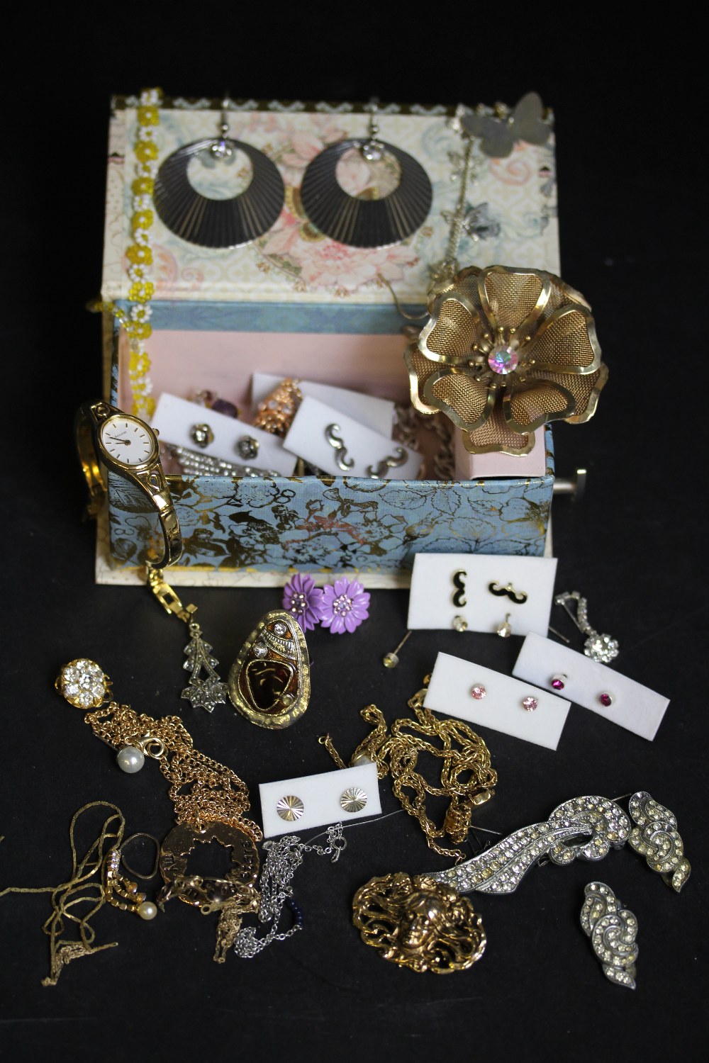 Decorated card musical jewellery box and a selection of costume jewellery