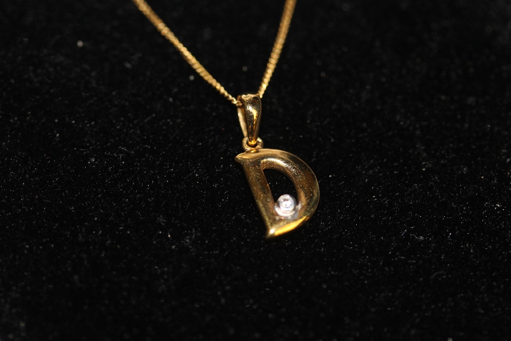 9ct gold diamond chip set 'D' pendant and fine 9ct gold chain 1.2grams gross weight - Image 2 of 2