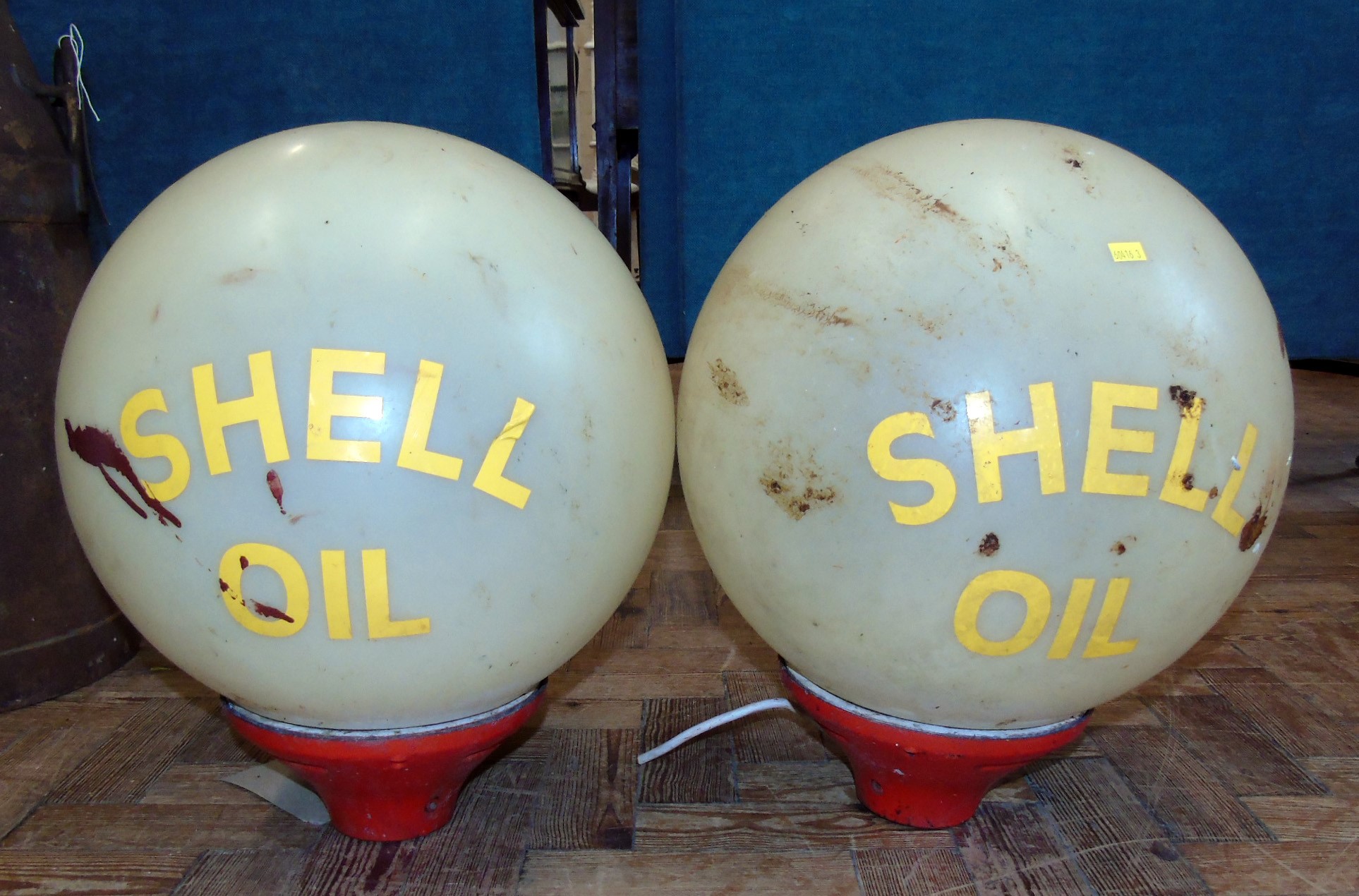 Pair of globe light fittings with Shell Oil attached labels. Condition reports are not availabe