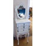 White painted dressing chest on open base with three drawers, two jewellery compartments and swing