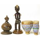 Two African figures and a set of bongos, the tallest figure stands 36cm high Condition reports are