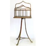 Oak and brass magazine rack on stand. Condition reports are not availabe for our Interiors Sales.