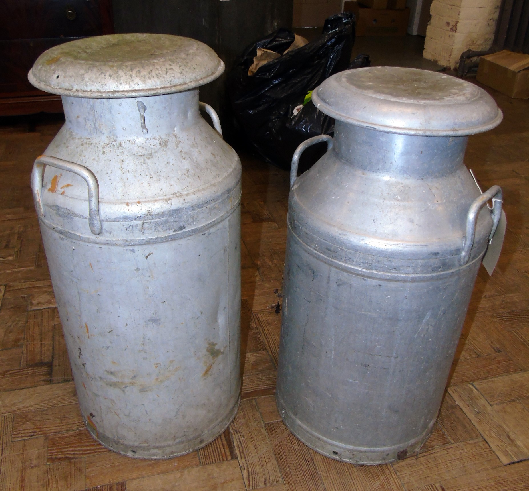 Pair Alloy "London" milk churns. Condition reports are not availabe for our Interiors Sales.